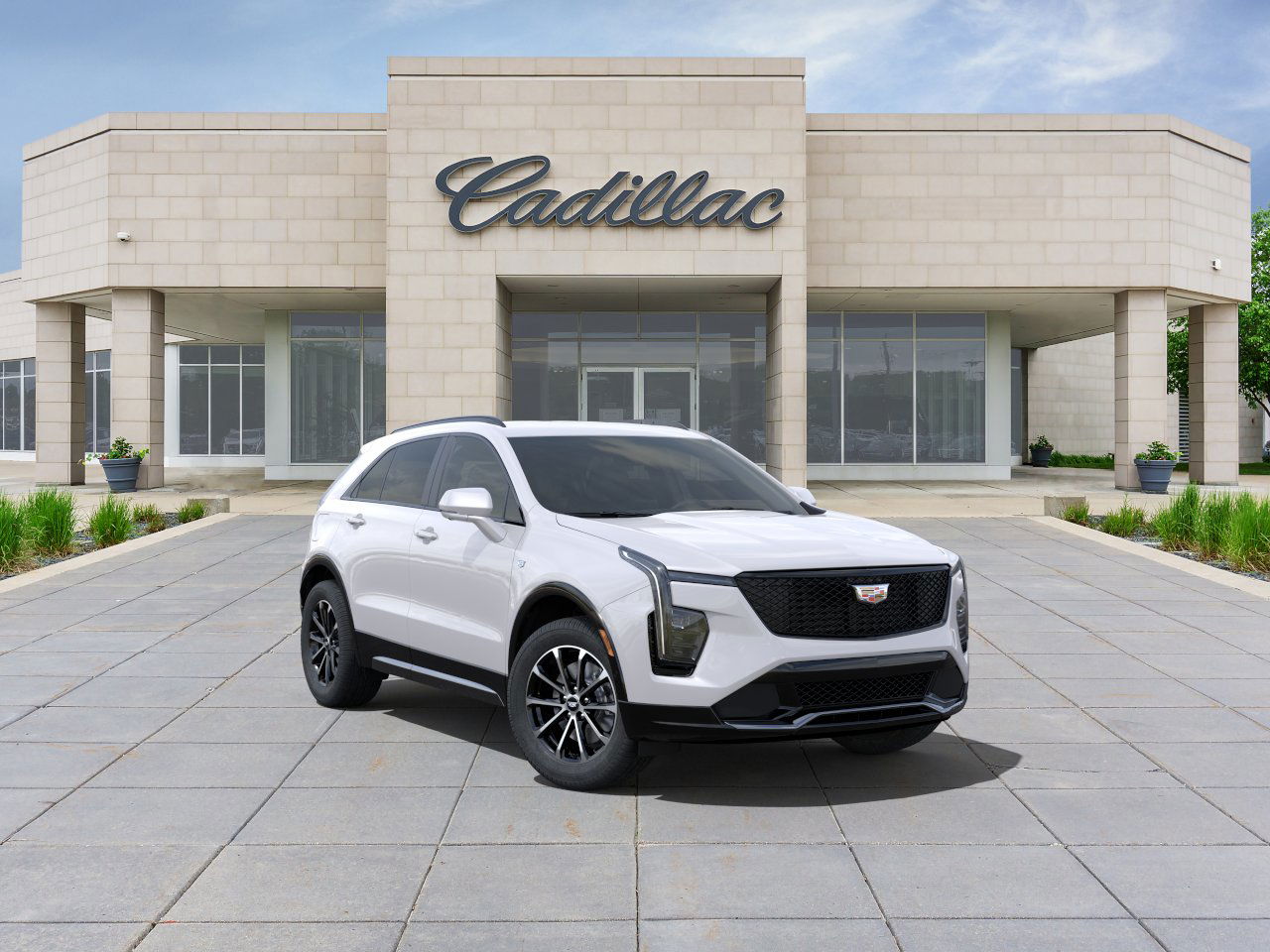 2025 Cadillac XT4 in front of Cadillac dealership