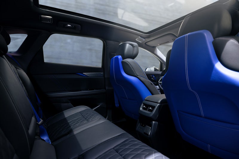 Back Seat View of the 2026 OPTIQ-V Blue Front Seats, Sun Roof, and Interior | Wallace Cadillac, LLC in Stuart FL