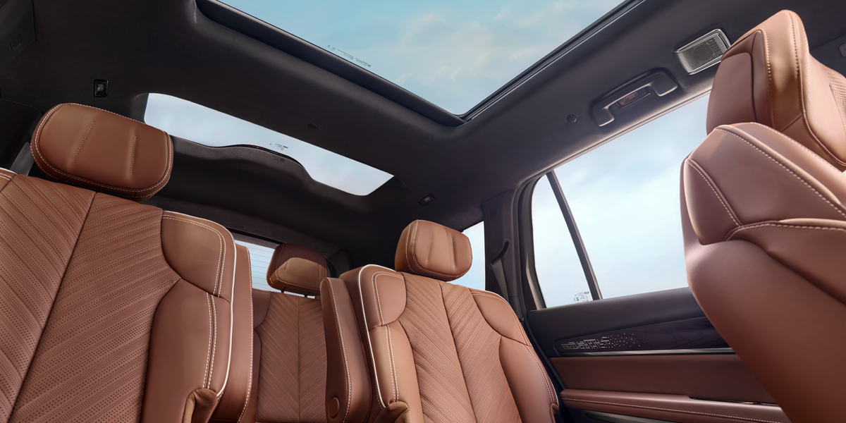 Floorboard View of the Cadillac VISTIQ's Two Brown Leather Back Rows and Dual Pane Sunroof
